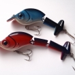 Wobbler s vrtulkou. Shora dvoud�ln�, d�lka 95 mm, 15 g a t��d�ln�, d�lka 120 mm, 18 g. Montovan� s 2 trojh��ky. Plovouc�. V�robce J.M.B. RYNA.