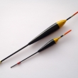 Balzový splávek, zleva celková délka 185 mm, zátěž 4,5 g a 115 mm, zátěž 0,7 g. Barevná varianta žluto-černá.