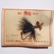 *FANTOM. Pstruhov� pestrobarevn� p��ov� t�pytka s k�id�lkovou rota�n� hlavi�kou (niklovan�), montovan� s um�lou mu�kou (Zulu). Origin�ln� balen� na kart�.