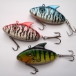 FLAT, d�lka 55 mm, 8 g. Wobbler montovan� s 1 dvojh��kem a 1 trojh��kem. Plovouc�, zvukov�. V�robce J.M.B. RYNA. R�zn� dekory.